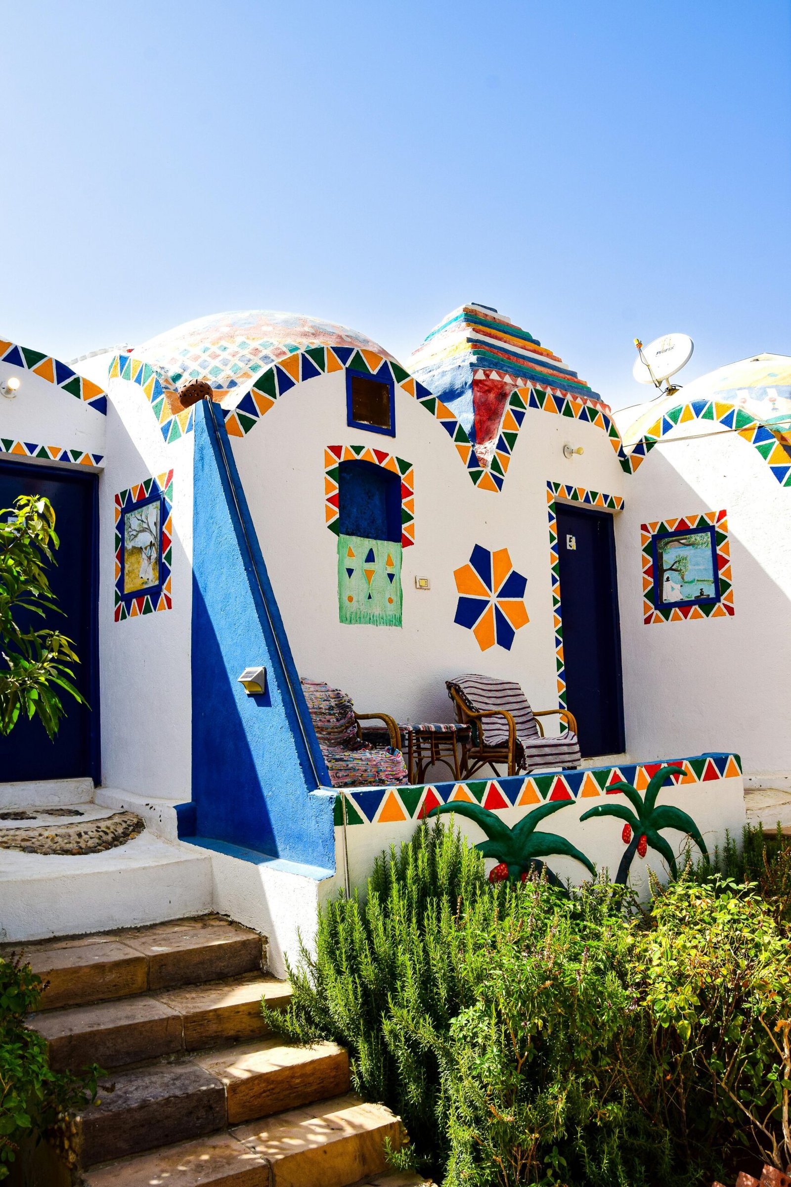 Colorful Nubian architecture with vibrant patterns in Aswan, Egypt.